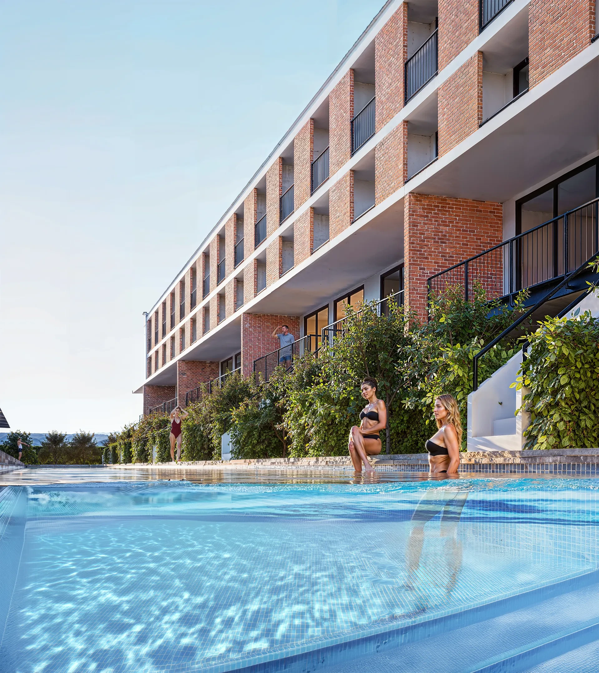 Terraced building above a pool