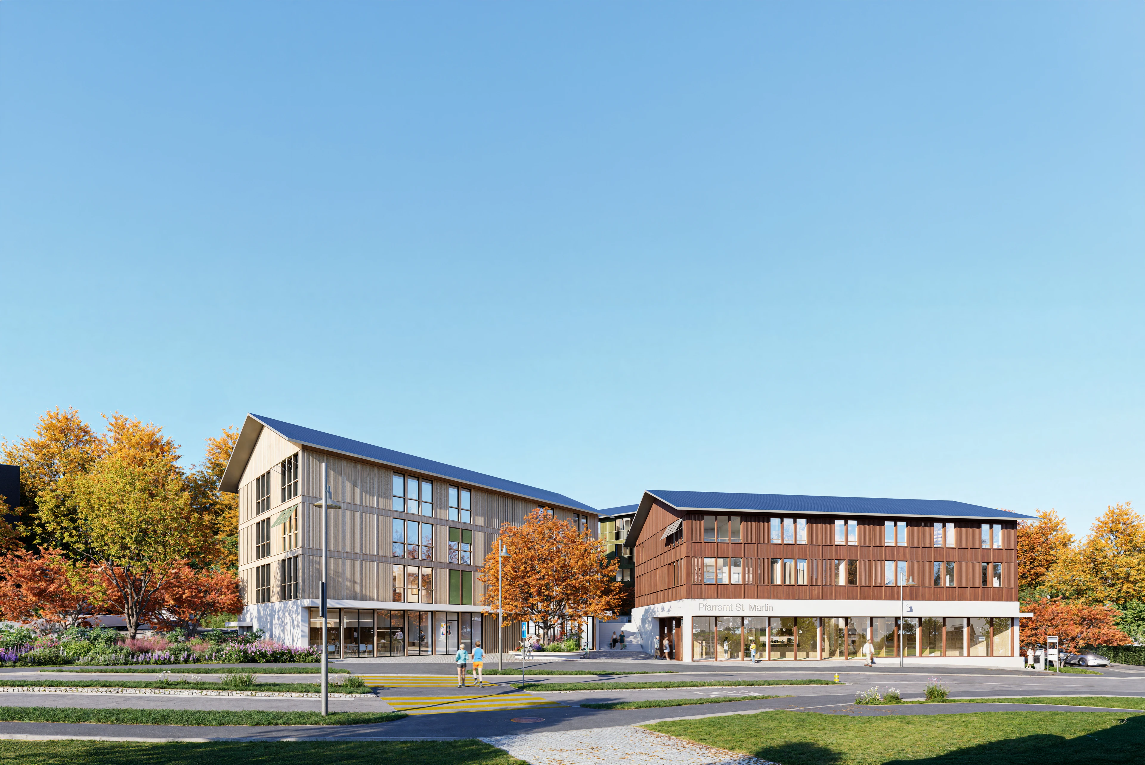 Zwei Holzbauten des Kirchenzentrums im Herbst